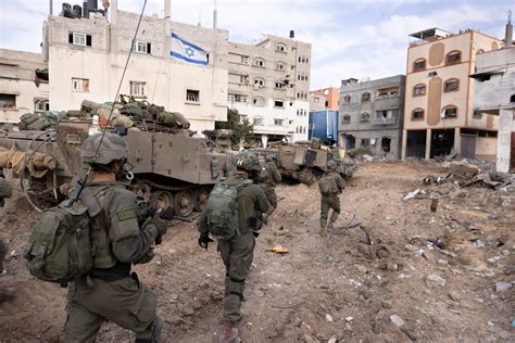 Israel battles militants in Gaza’s main cities, with civilians still trapped in the crossfire